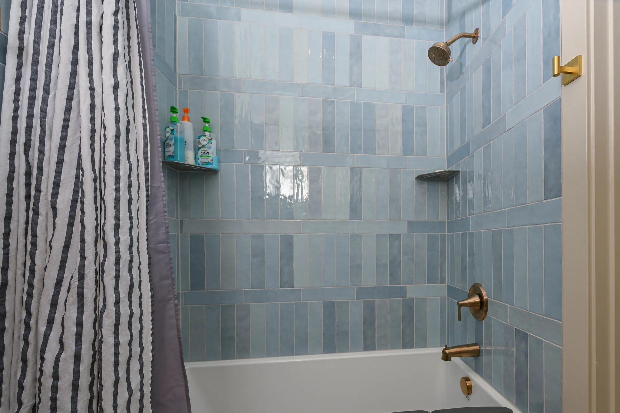 Tub and shower surround in blue tile